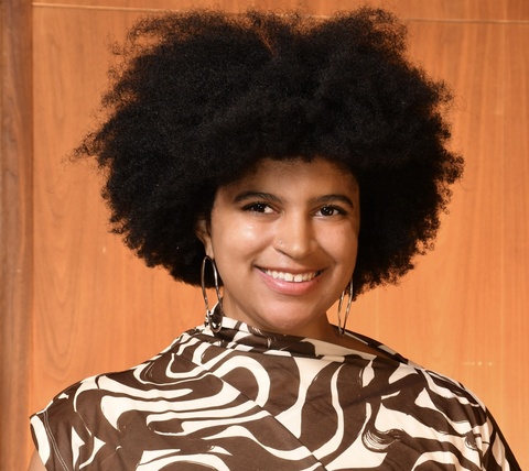 Grace Morse portrait with orange background