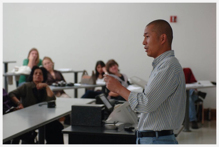 a teacher speaking to students in a classroom