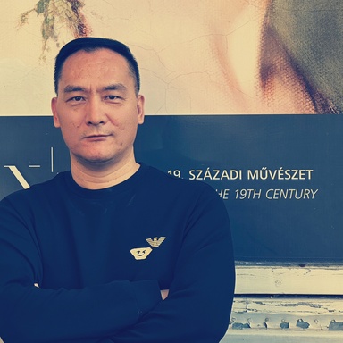zhang in front of large painting