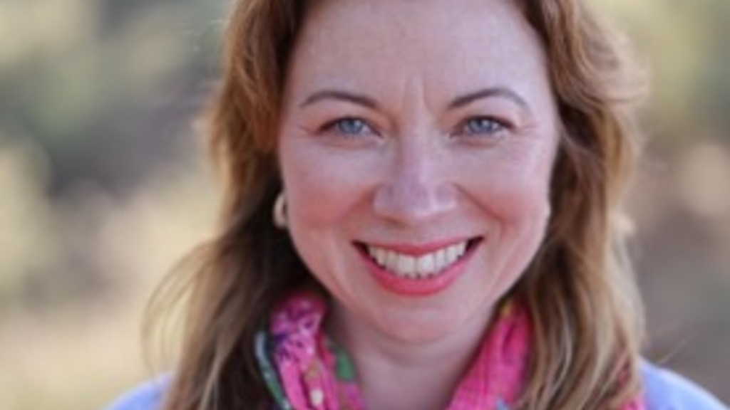 Kate O'Brien wearing bright scarf